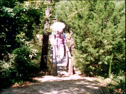 1956 ; Meher Center, Myrtle Beach, SC. ; Meher Baba walking across the Center's bridge. The images were captured by Anthony Zois from a film by Sufism Reoriented.