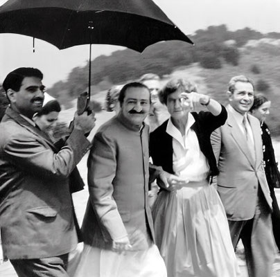 AVATAR MEHER BABA at Meher Mount on August 2, 1956, with Eruch Jessawalla holding the umbrella and Agnes Baron pointing out landmarks