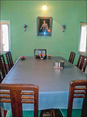The dining room table with Baba's chair at the far end