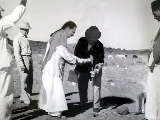 13th August 1939  Meher Baba hammering a spike deep into the ground at the Central Point of the property.