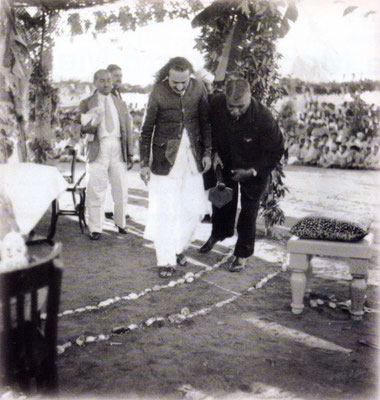 17th December 1939 - Meher Baba looking for the centre spot to lay the Foundation stone for the new Centre. " Papa" Bhyrumshaw D. Jessawala is assisting Baba, with Kaka Baria following.