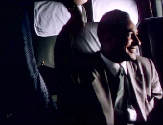 Meherjee Karkaria sitting opposite Meher Baba flying from Newark, NY to Wilmington NC., on this plane. Image captured from a film by Anthony Zois