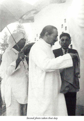 New Life- Baba accepting bhiksha, Elcha Mistry looking on.