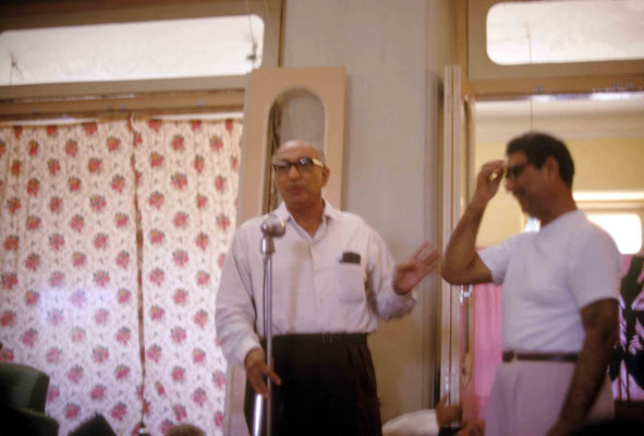 Sarosh Irani speaking with Eruch next to him. Courtesy of Larry & Rita Karrasch