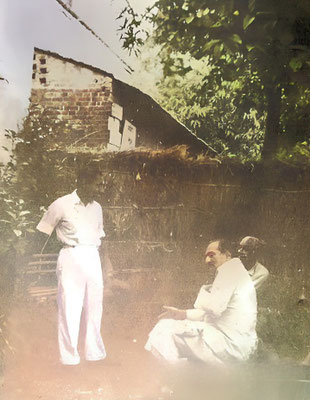 1950 : Meher Baba in the backyard of 29 Lytton Road in conversation with Burjor Chachain Dehra Dun. Image coloured by Anthony Zois.
