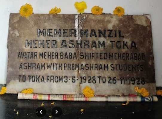 Close up a plaque commemorating the time when Meher Baba stayed in Toka.