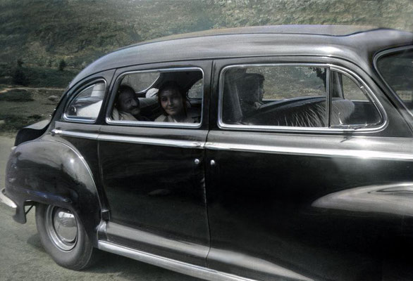 6th Aug. 1952. Baba with Mehera next to him & Mani on far side of their car, on their way to Locarno from Zurich. Image rendered by Anthony Zois.
