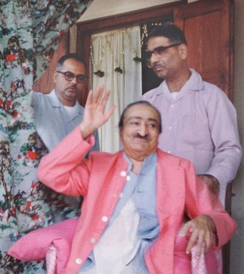 This photo was taken earlier in the wedding celebrations at Meherazad, India. Bhau Kalchuri (left) & Eruch Jessawala assisting Meher Baba.