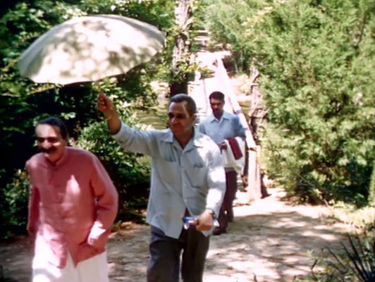 1956 ; Meher Center, Myrtle Beach, SC. ; Meher Baba walking across the Center's bridge. The images were captured by Anthony Zois from a film by Sufism Reoriented.