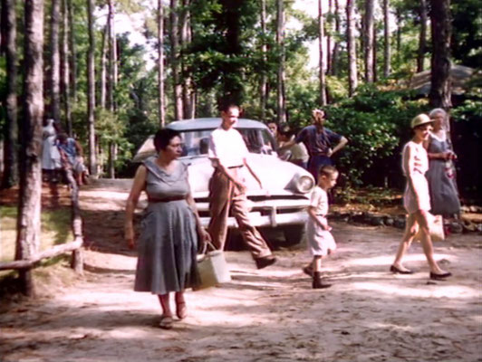 1956 ; Meher Center, Myrtle Beach, SC. ; The Karrasch family walking on the Center and Annarosa'a mother Theresa DeBlasio (left). The images were captured by Anthony Zois from a film by Sufism Reoriented.