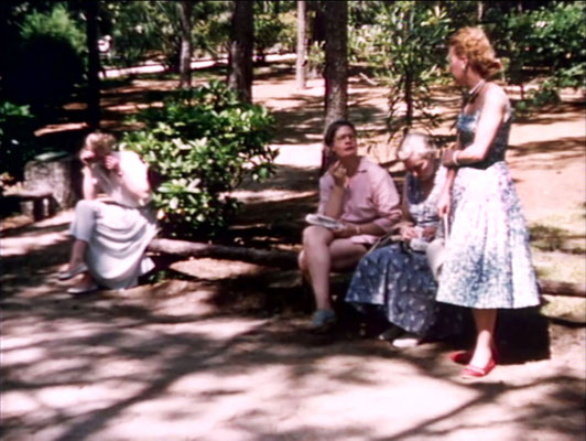 1956 ; Meher Center, Myrtle Beach, SC. ; Marion talking to Filis Frederick ( pink ). The images were captured by Anthony Zois from a film by Sufism Reoriented.
