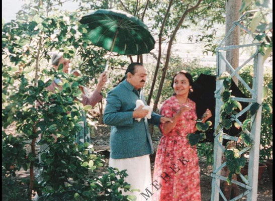 Rano holding an umbrella