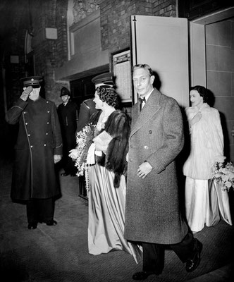 King George 6th, Queen Elizabeth and Princess Margaret arriving for a show at the theatre. 