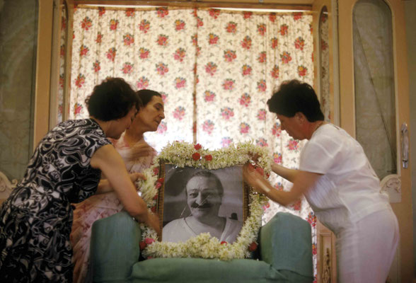 Mehera Irani & ladies garlanding Baba's photo. Courtesy of Larry & Rita Karrasch