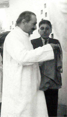 New Life- Baba accepting bhiksha, Elcha Mistry looking on.
