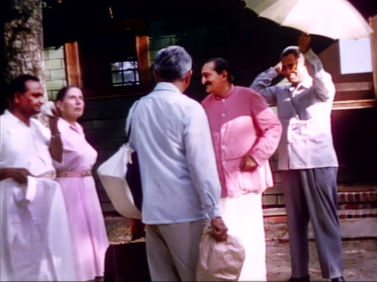 1956 ; Meher Center, Myrtle Beach, SC. ; Meher Baba with his men mandali and Kitty Davy outside the Lagoon Cabin. The images were captured by Anthony Zois from a film by Sufism Reoriented.