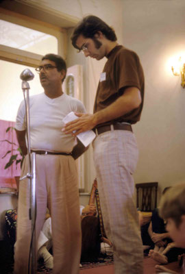 Eruch speaking to the visitors with a visitor next to him. Courtesy of Larry & Rita Karrasch