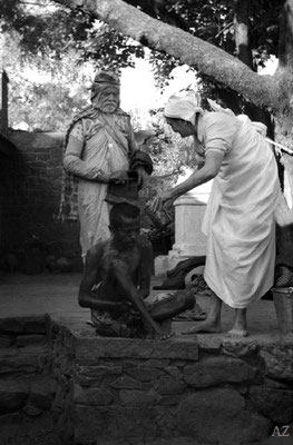 7th Nov.  Meher Baba washing a leper in the leper colony
