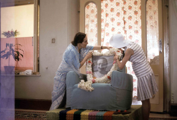 Mehera Irani & Annarosa Karrasch garlanding Baba's photo. Courtesy of Larry & Rita Karrasch