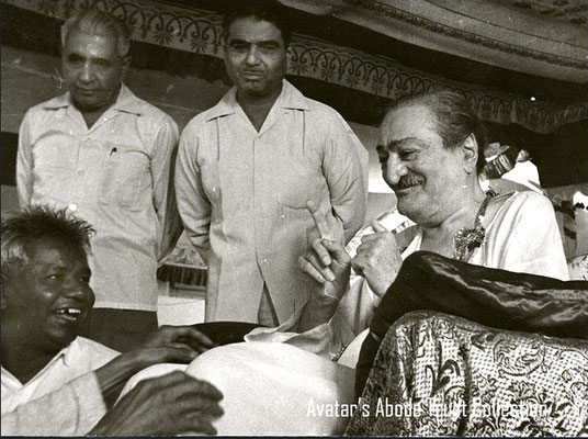 May 1965 - Guruprasad, Poona, India. Baba gesturing to Pukar. Adi & Eruch in b/ground. Photo taken by Peter Rowan. Courtesy Of Avatar's Abode Archives.