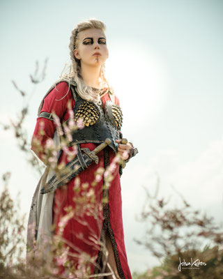 Viking costume made with hand dyed linen and leatherwork.