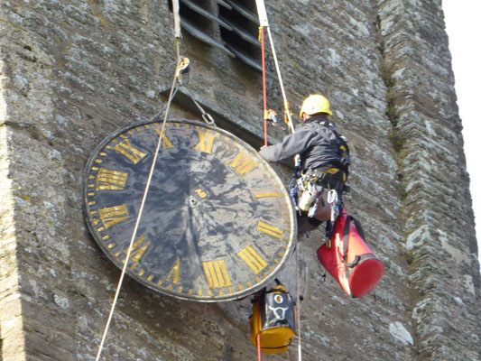 Arthur brings the clock face down to the ground