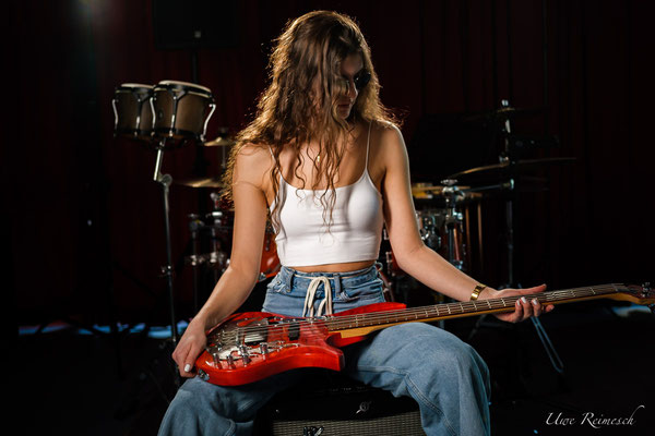 guitar on her knees