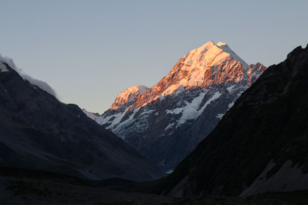 Aoraki/Mount Cook bathed in sunset hues, New Zealand.