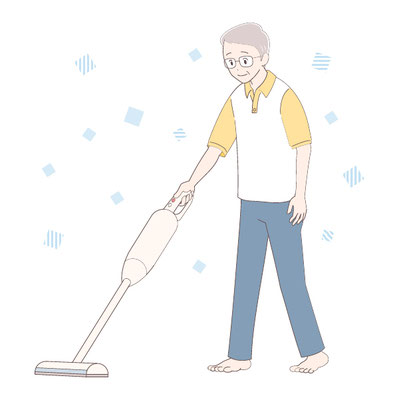 掃除機をかける高齢男性
