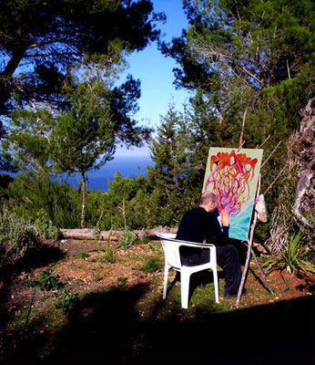 Vigor Calma, painting in fron of his houses on Ibiza