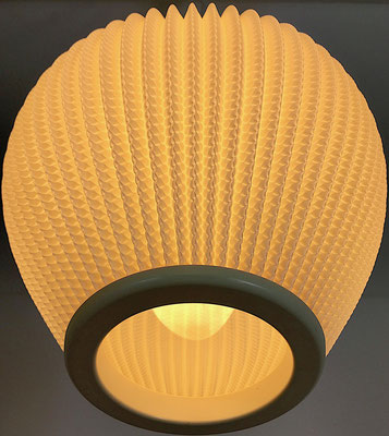 Coccon made of pleated plastic, light beige.