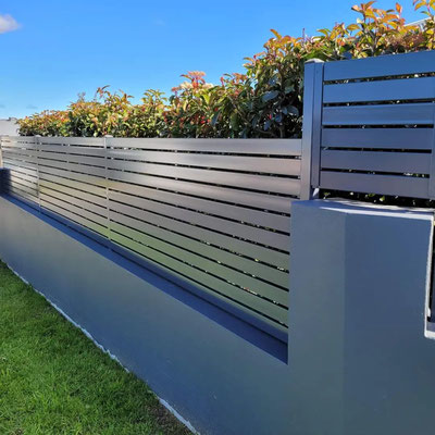 professional electrostatic spray painting of slat fences and gates for a home near Narellan by Alpha Coatings