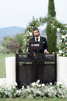 Repurposed aisle flowers for DJ 