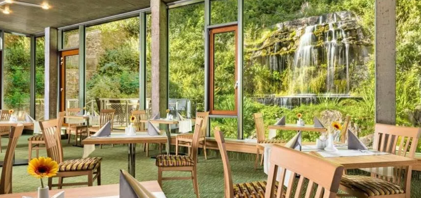 Hotel Astoria*** - Restaurant mit Waßerfall Ansicht