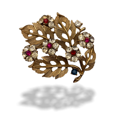 Lovely floral arrangement bouquet Brooch textured leaves in goldtone and small flowers in clear and red stones-art.225/2