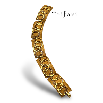 Crown Trifari glossy Circle Pattern Bracelet in gold tone - Articulated rectangle Links bracelet for a timeless elegance -685/6