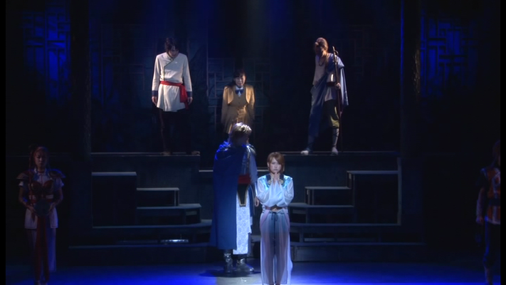 Durch einen Schutzschild getrennt müssen Miaka und die beiden Seishi zusehen, wie Yui's Zeremonie geginnt 