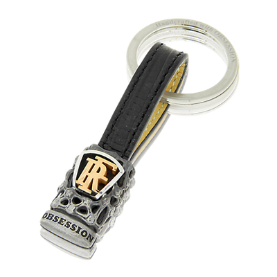 Schlüsselanhänger Mikrokosmos in Silber mit Monogramm in Rotgold und passendem Lederband.