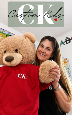 Erica with Zilla, the Custom Kids mascot.
