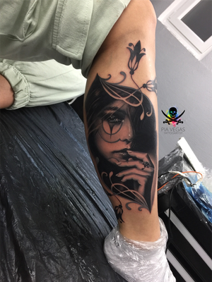 melancholy black and white leg tattoo