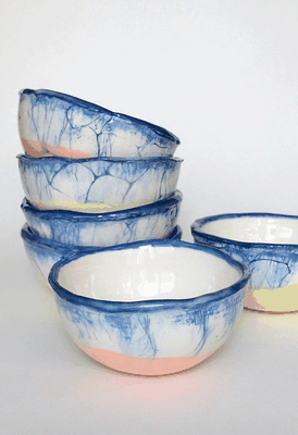 These unique bowls are hand built in "Jasmin" earthenware. The native colour of the material is a gentle creamy white. They are coloured with cobalt blue and soft orange/yellow underglaze and finalised with transparent glazing.