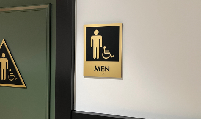 Restroom ADA Sign by Landmark Signs Inc. 