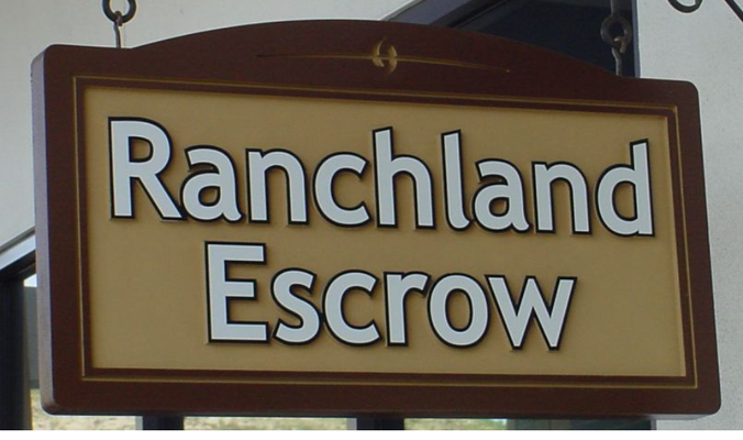 Ranchland Escrow Wood Sign by Landmark Signs Inc.