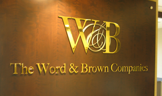 Word & Brown Wood Sign by Landmark Signs Inc.