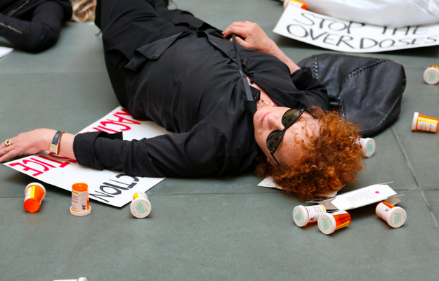 NAN GOLDIN during one of her died-in's (actions of protest against the opioid crisis), in New York, August 2019, as reported by ArtnetNews 