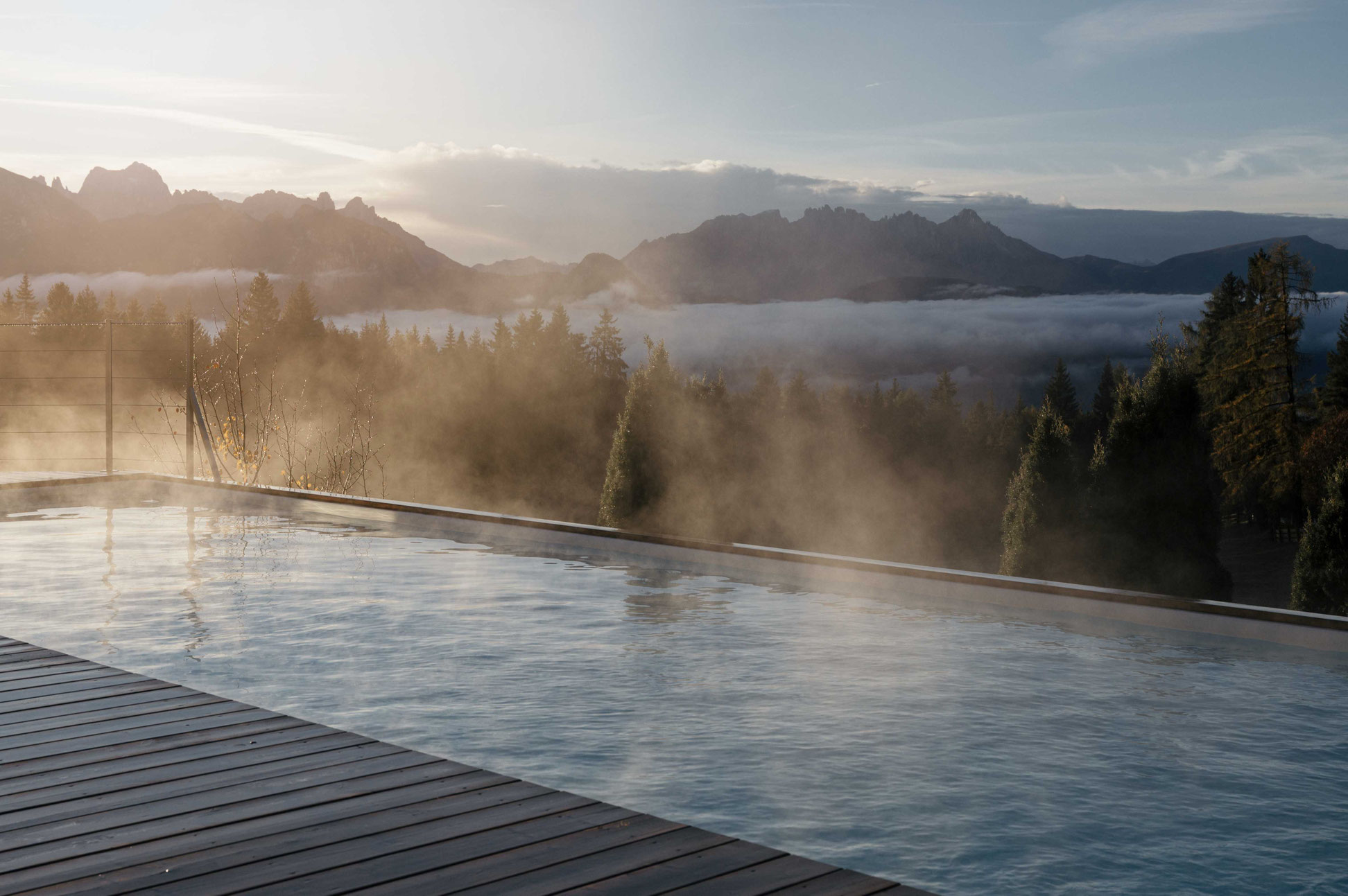 Infinity pool at Hotel Tann on the Ritten plateau in South Tyrol with panoramic views of the Dolomites. _fullwidth-story-splash