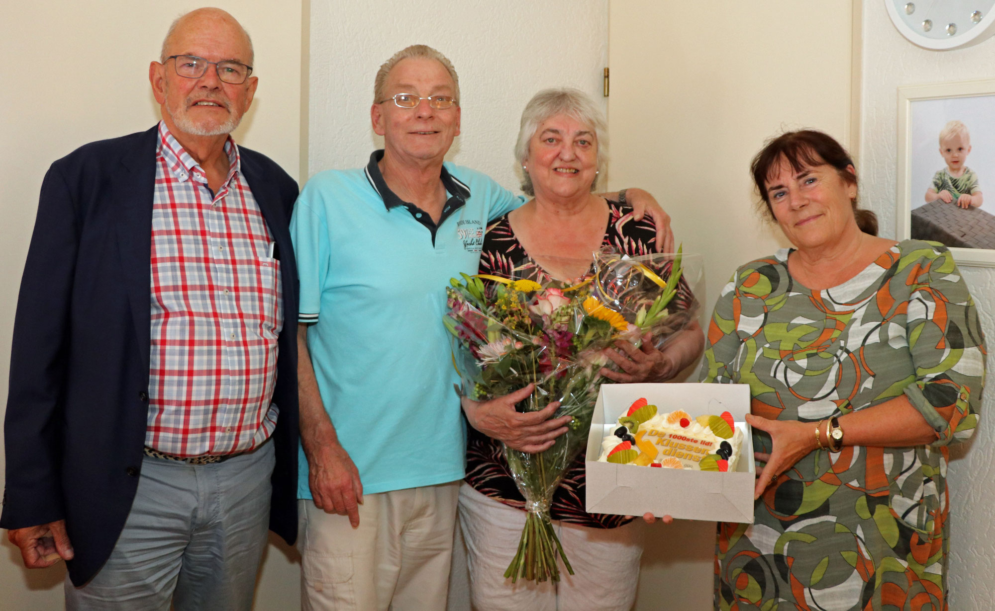 Bloemen en taart voor 1000ste lid Klussendienst