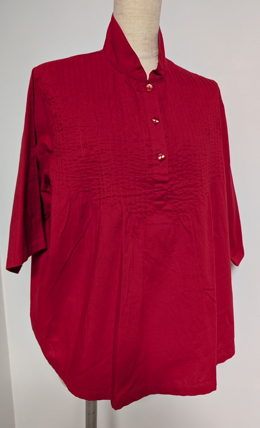 A vibrant red blouse in the hot summer