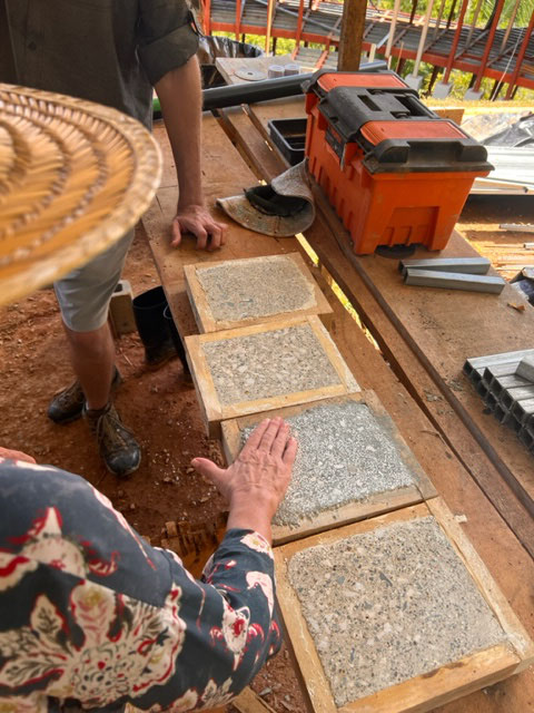 August 2023 - pattern of terrazzo-like polished concrete for the shower floor and the edge of the pool