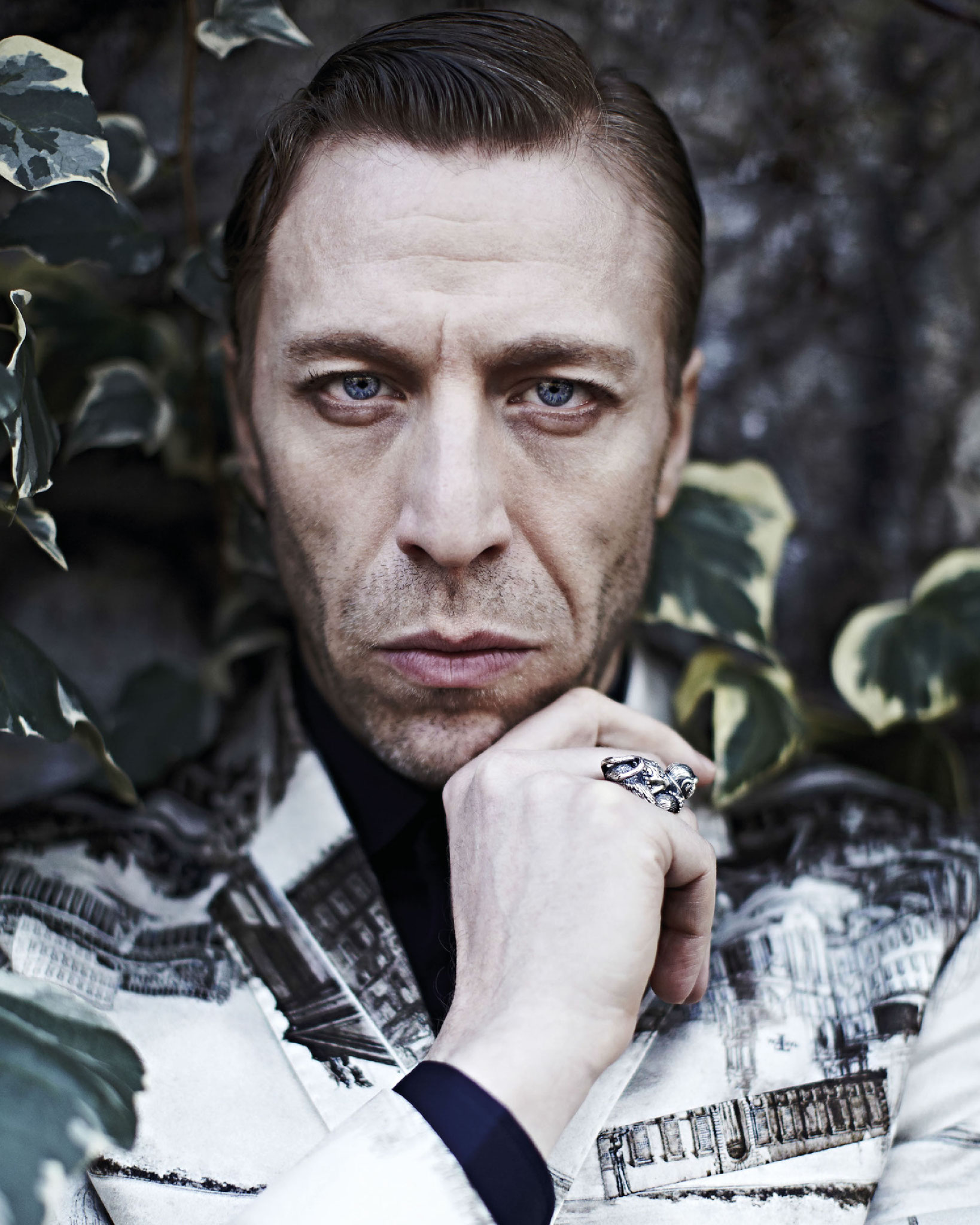 Ottaviano Blitch, Italian actor and performer, intense black and white cinematic close-up portrait with dramatic lighting, attore performer italiano ritratto cinematografico